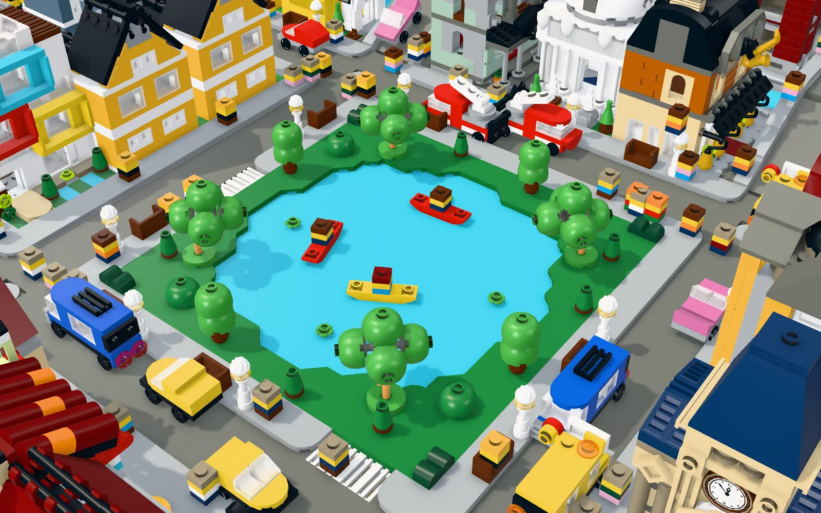A park with a lake, kayaks and trees surrounded by streets